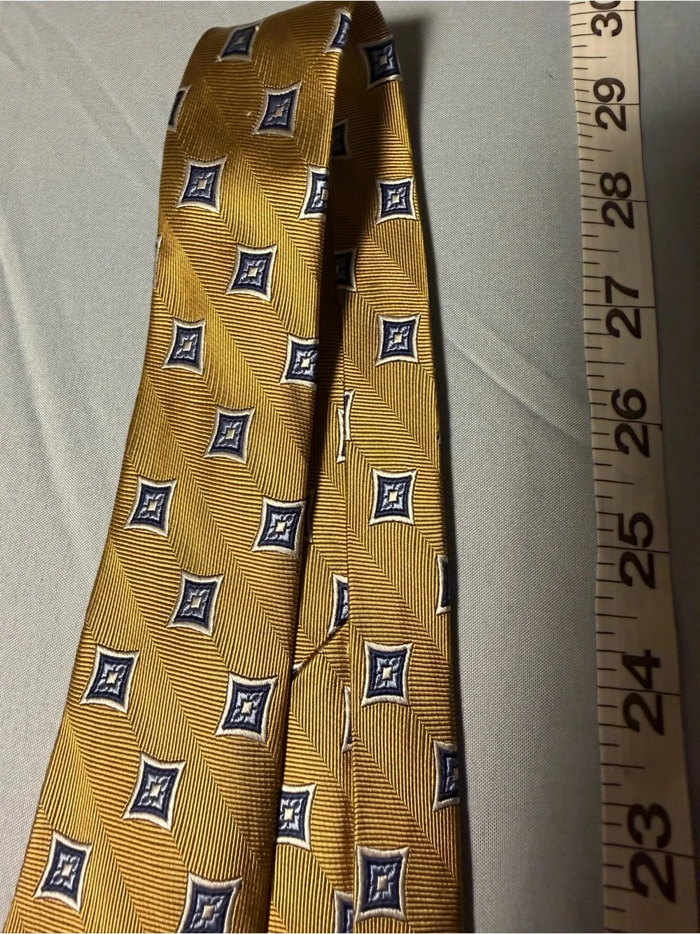 Jos. A. Bank Gold Tie with Navy Geometric Medallions
